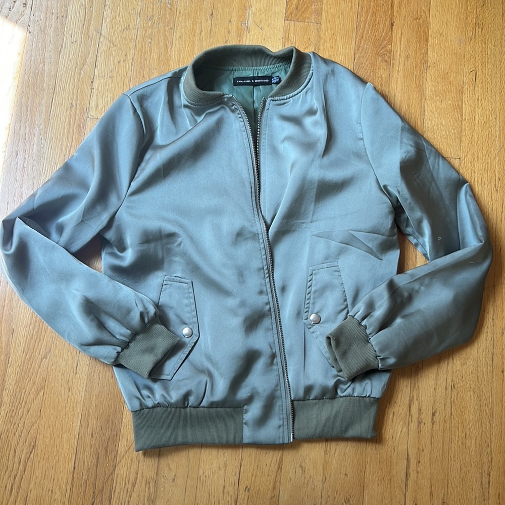 Carli Bybel x Missguided green polyester jacket.